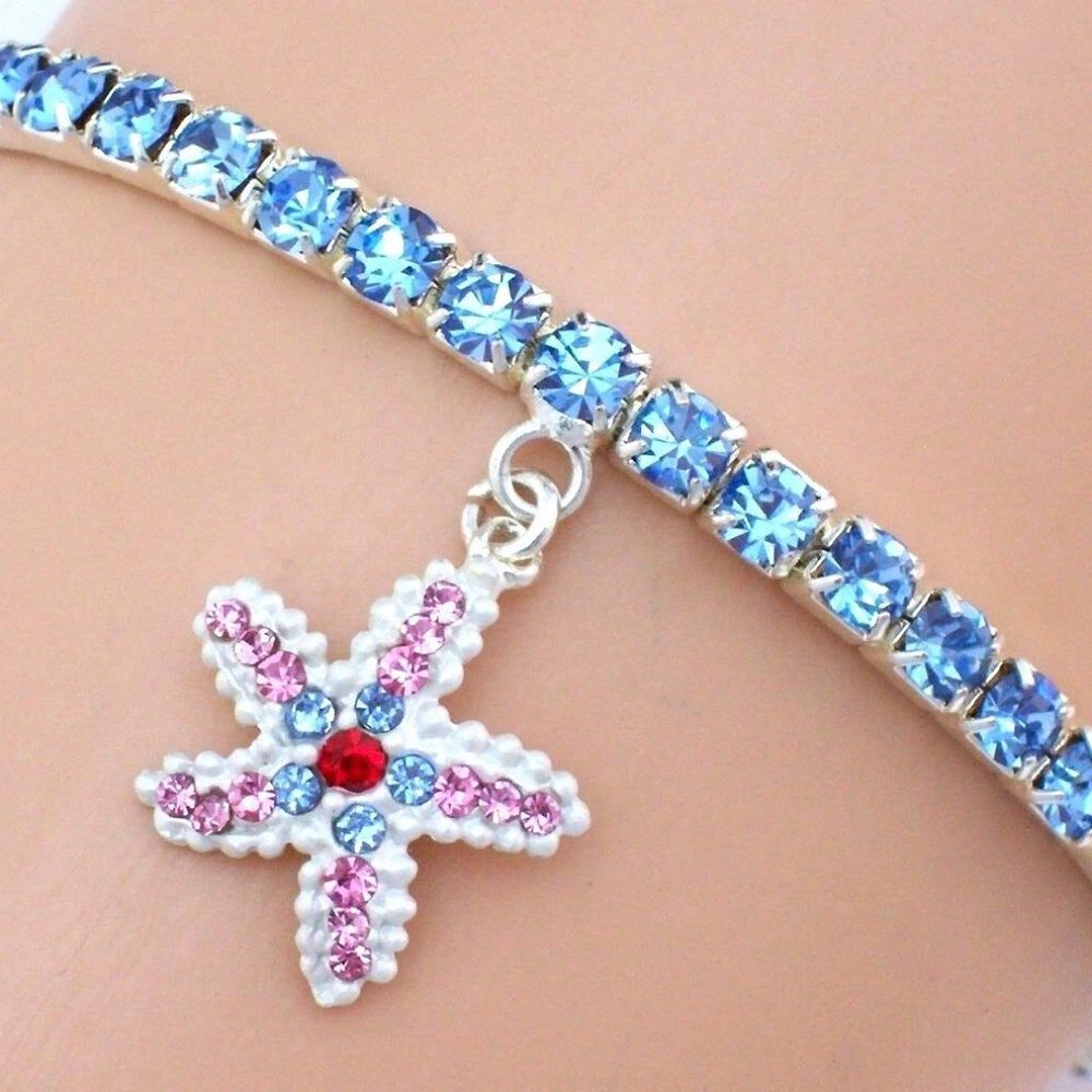 NWT Beautiful Stretch Light Blue Swarovski Crystal Bracelet w/Starfish Charm